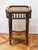 A high side table in the classicist style of Louis XVI decorated with rich marquetry and bronze applications. Beneath the...