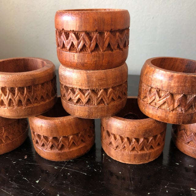 Beautiful collection of Bohemian style wooden hand carved napkin holders. Perfect for setting your holiday table.