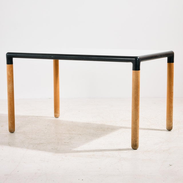 The ‘Flex 2000’ dining table from the 1980s designed by Gerd Lange for Thonet. The table has clean lines with beech legs...