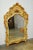 Stunning Italian Venetian style mirror decorated in the chinoiserie taste featuring a hand-carved frame finished with an...