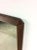This mid century modern mirror features hardwood frame, original walnut finish, angular frame, and partial mounting hardware.