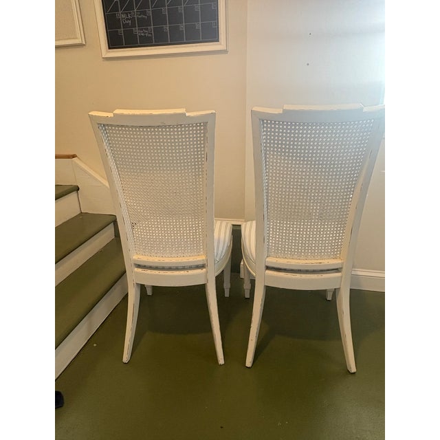 Beautiful pair of authentic mid-century (circa 1960s) French Neoclassical / Louis XVI style dining side chairs. Expertly...