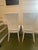 Beautiful pair of authentic mid-century (circa 1960s) French Neoclassical / Louis XVI style dining side chairs. Expertly...