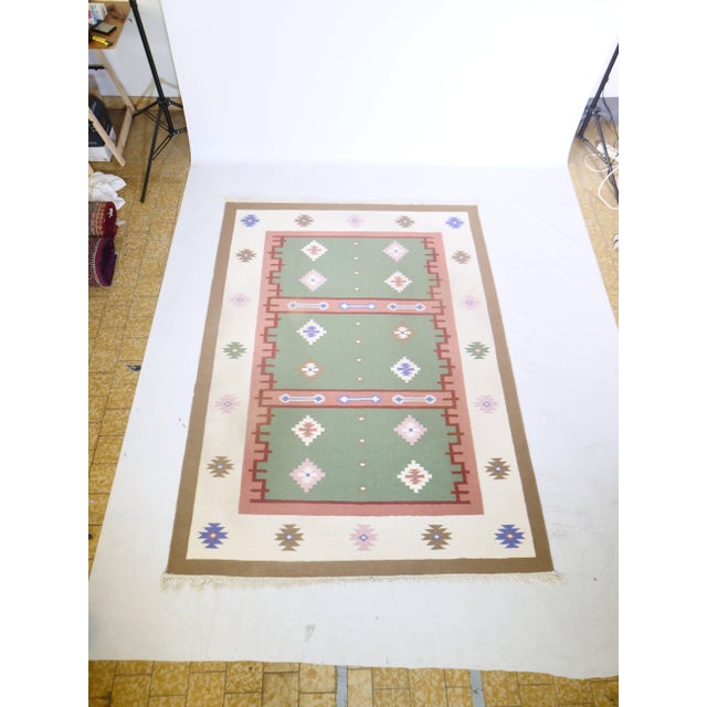 A true vintage wool rug from the late 1970s or early 1980s in stunning pastel cream colors from Turkey, possibly Morocco....