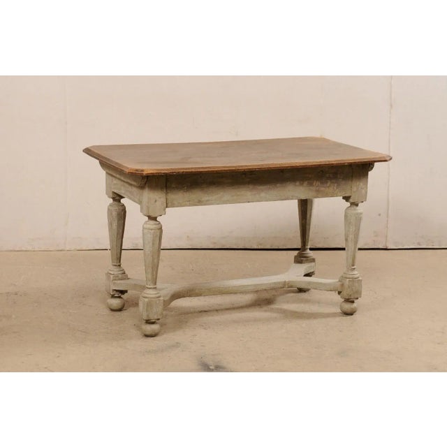 A Swedish Baroque period painted wood occasional table from the turn of the 17th and 18th century. This antique table from...