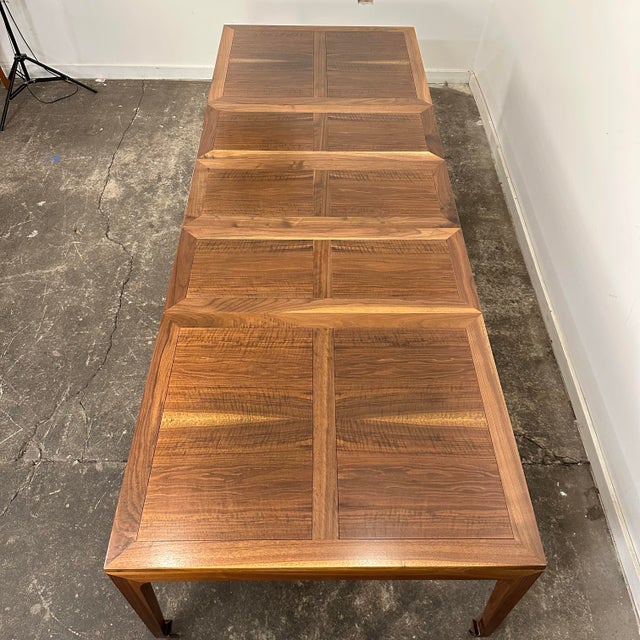 This is a vintage Baker dining table designed by Michael Taylor. It features incredible wood grain inset and framed by...
