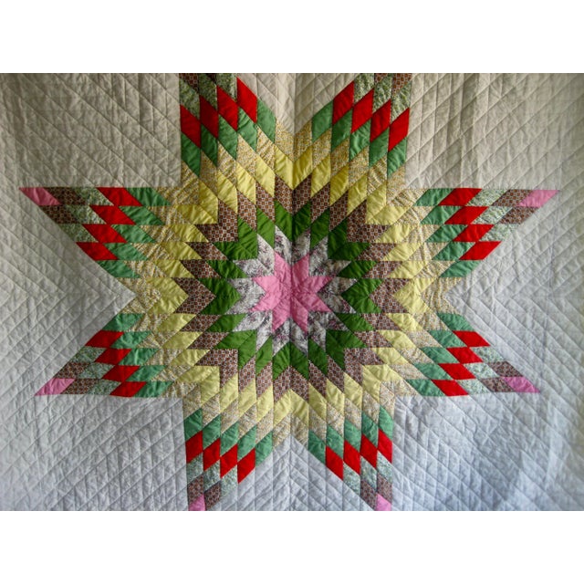 Impressive Amish vintage quilt that present a very large patchwork star , the star is done out a many different mid...