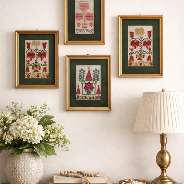 A curated set of four vintage Turkish folk art needlepoint panels, each hand-stitched with traditional Anatolian-inspired...