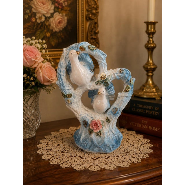 Exceptional vintage Capodimonte-style porcelain figural centerpiece featuring two graceful white doves perched within an...