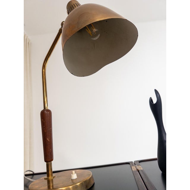 Elegant Swedish Modern table lamp produced by Bröderna Malmströms Metallvarufabrik, Malmö, during the 1950s. Model “2790”....