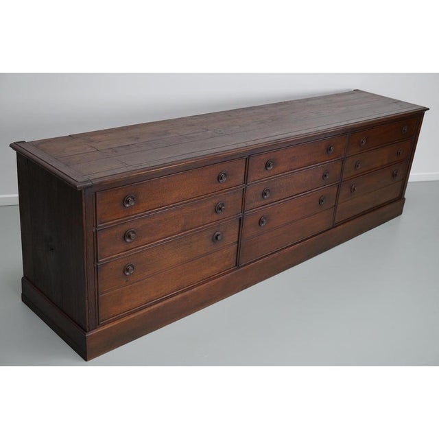 This large oak apothecary cabinet was made circa 1900s in France. It was originally a museum cabinet. The interior...