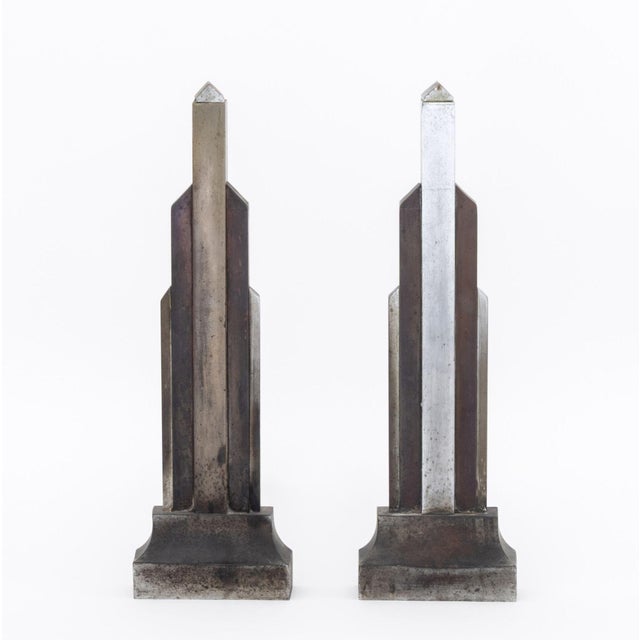 Donald Deskey (American, 1894-1989) Pair of Art Deco Skyscraper Andirons. 18" H x 17" W x 5.5" D. Provenance: From a West...