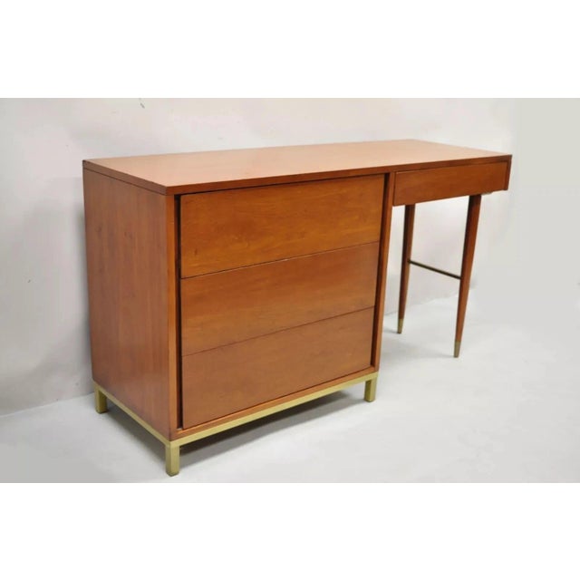Vintage Mid Century Modern Walnut Brass Base Modernist Kneehole Writing Desk. Item features a unique brass base and...