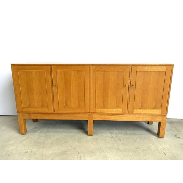 Vintage oak highboard by Belgian manufacturer VandenBerghe Pauvers. The 4 doors reveal plenty of storage space Made from...