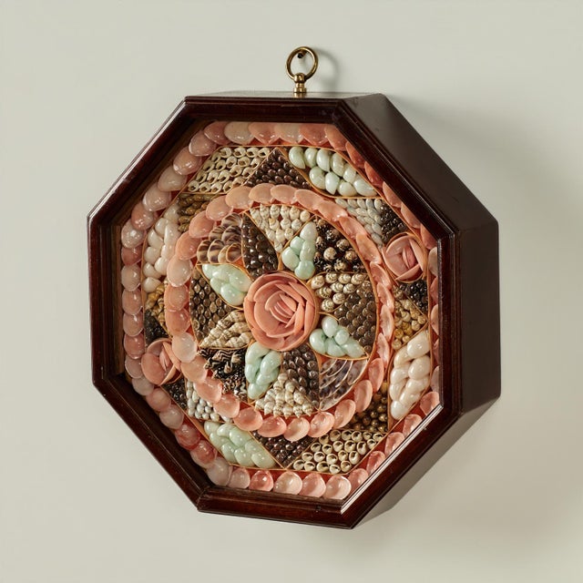 Enchanting vintage sailors valentine handcrafted with exotic seashells ambitiously arranged in a romantic floral...