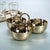 Aperitifs Cocktail Condiment Bowl Set- Polished Gold Polished gold condiment set featuring three bowls arranged on a...