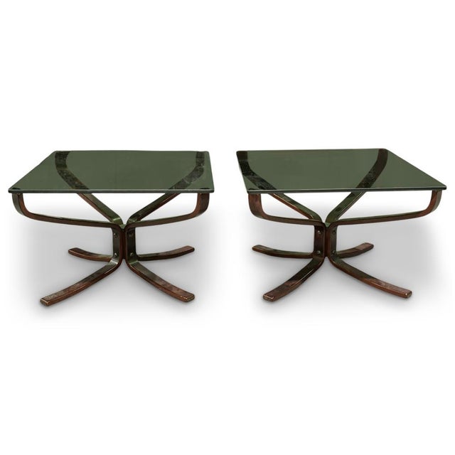 A pair of Falcon Tables by Pair Sigurd Russell for Vatne Mobler. The Norwegian 1960's side tables feature sculptural...