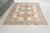Infuse your space with playfulness and character using this delightful vintage Turkish rug. Featuring a cream-colored...