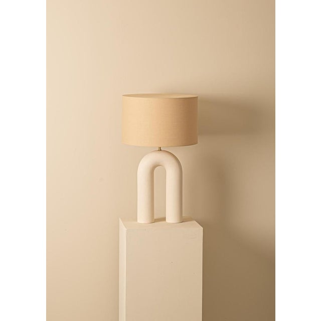 Ecru ceramic arko table lamp with light brown lampshade by simone & marcel dimensions: ø 40 x h 67 cm. Materials: cotton...