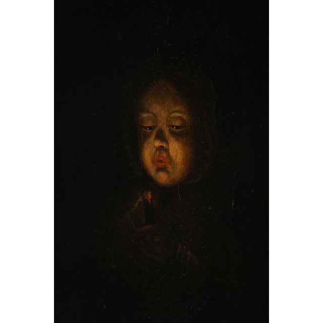 Oil on canvas, chiaroscuro portrait titled “Figure Blowing Out a Candle.” 19th-century Dutch or French school, in the...