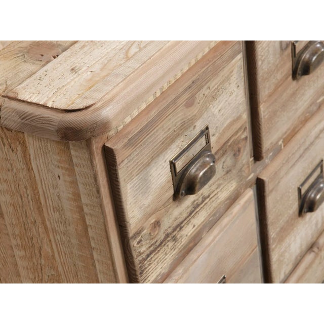 This design is reminiscent of antique apothecary cabinets. It features 24 drawers and is made of antique fir. The internal...
