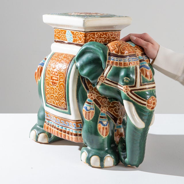 A ceramic decoration from 1960s France in the shape of an elephant. Glazed in celadon hues laced with powder blue and...