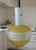 A beautiful yellow glass pendant lamp, original vintage from the 1960s. The style is pure mid-century and would be ideal...
