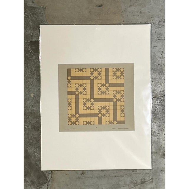 This vintage Mid-Century Modern serigraph presents a meticulous arrangement of interlocking geometric shapes, beautifully...