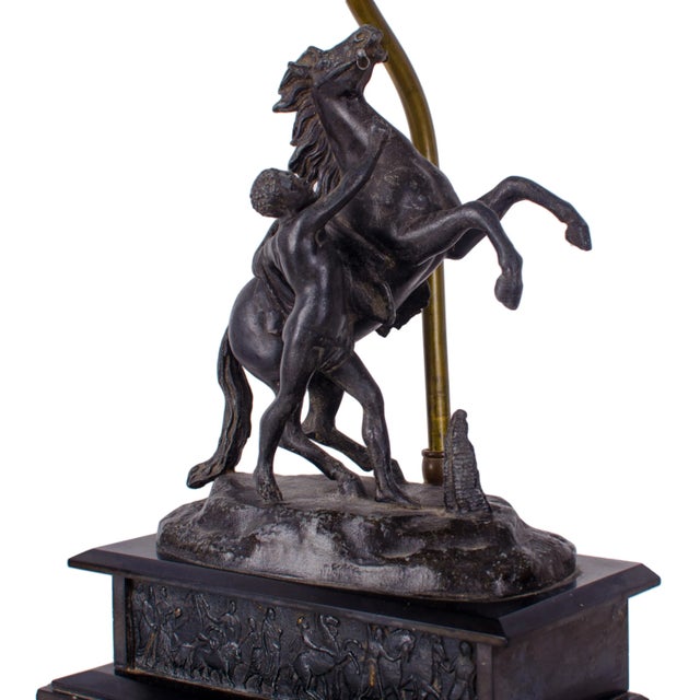 Marly horse spelter sculpture after Guillaume Coustou mounted as lamp. Rearing horse with attendant groom on black figural...