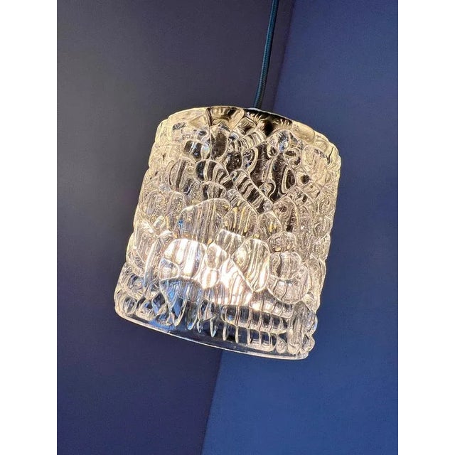 This glass lamp from Denmark impresses with its simple and elegant design. The high-quality glass ensures pleasant light...