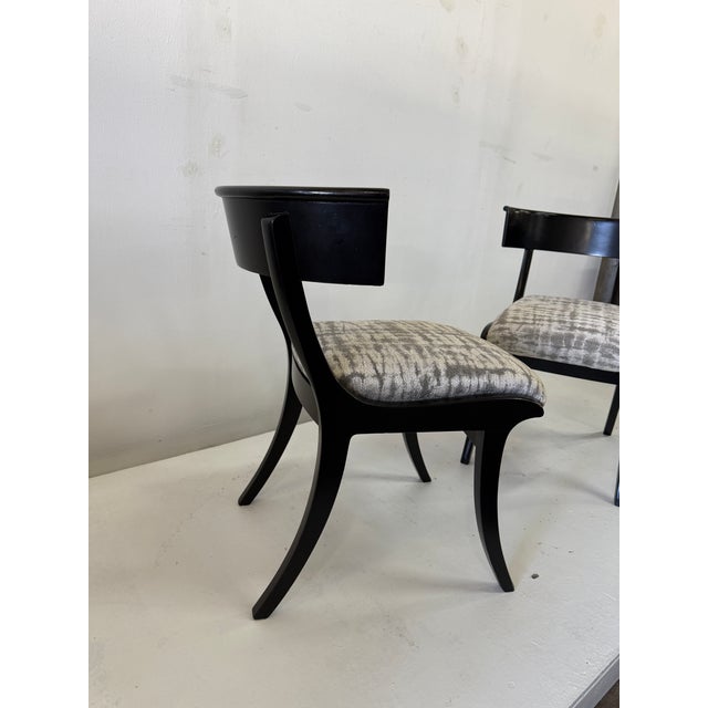 A pair of vintage Danish Klismos chairs. Ebonized hardwood with muted and elegant upholstery in very good condition. The...
