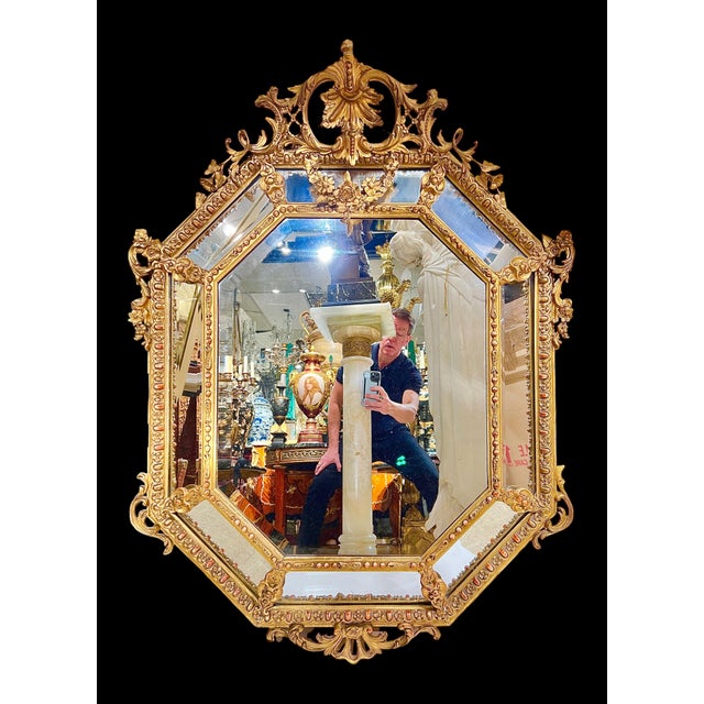 Beautiful rectangular giltwood wall or overmantel mirror in the French Louis XVI style measuring 50 by 38 by 5 1/2 inches.