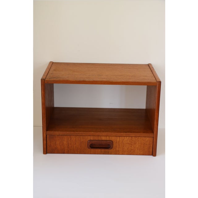 1960s Scandinavian wall-mounted bedside table. In very good condition despite its age. Materials: Teak veneer on...