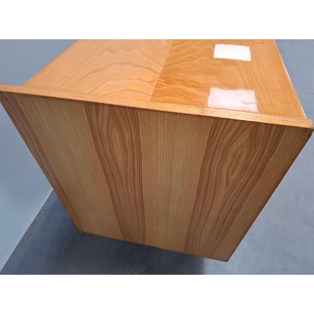 This Mid-Century Modern sideboard was produced in Czechoslovakia during the 1960s. It features a beautifully figured wood...