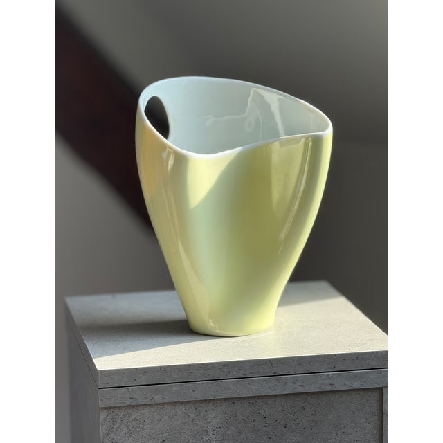 A porcelain vase by Rosenthal, designed by Beate Kuhn in the mid-1950s. The organically shaped, asymmetrical silhouette...