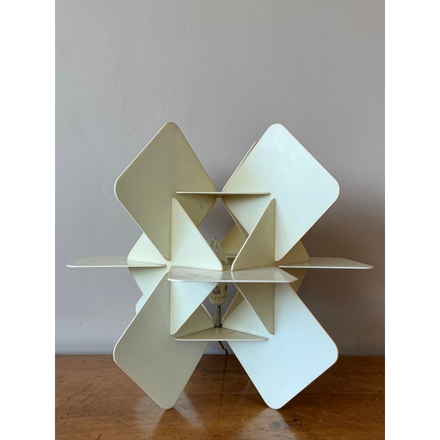 Illuminate your space with the sculptural brilliance of this vintage origami-style table lamp. A masterpiece of geometric...