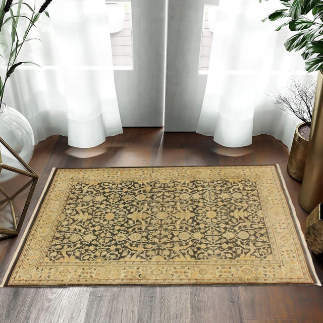 Enhance the ambiance of your home with this magnificent Persian-influenced Turkish hand-knotted rug made by skilled...