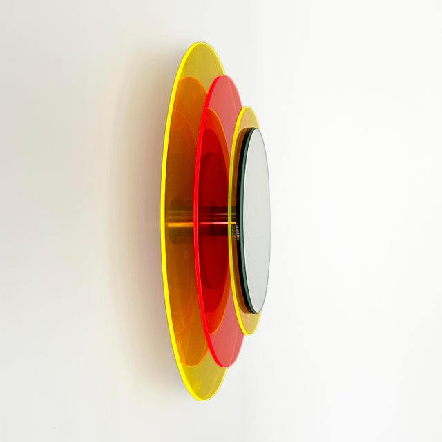 The mirror object float in front of the wall and creates a fascinating sculpture full of positive energy through color,...