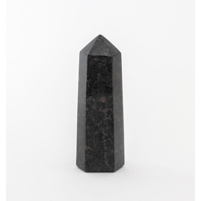 Group of Three Mineral Specimens, comprising: black and red granite obelisk, desert rose selenite, and Shiva Lingam stone....