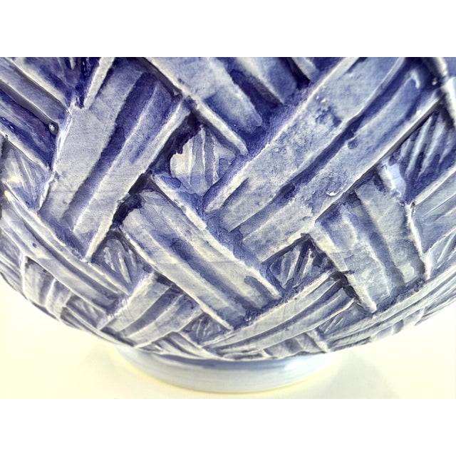 This Italian-made ceramic serving bowl captures the timeless elegance of coastal décor with its hand-painted blue glaze...