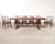 An iconic and rare set of eight mid-century modern dining chairs consisting of six side chairs and two host armchairs...