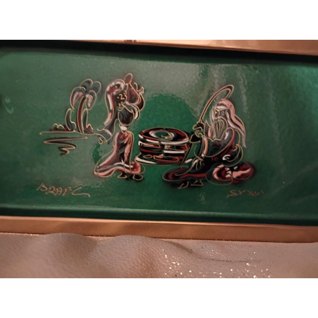 This striking vintage mid-century tray is a beautiful example of "Israeliana" metalwork. It features a vibrant, high-gloss...