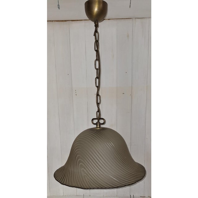 Vintage Ceiling Lamp with Lightly Tinted Relief Glass Shade on a Brass Mount, 1970s, in Very Good conditions. Designed...