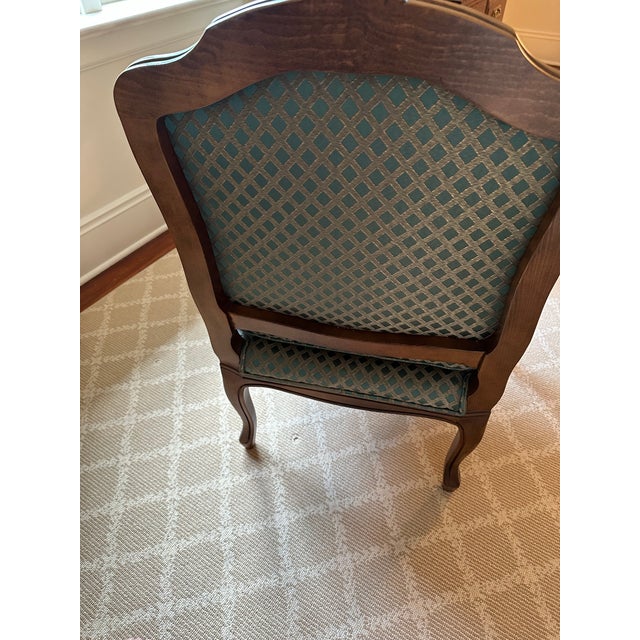 Beautiful matching pair of vintage French Louis XIV-style carved Fauteuil Chairs expertly crafted by Baker Furniture...