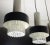 Very beautiful elegant 3-fold pendant lamp from the 60s. Ceiling fixture made of black painted and chromed metal. 3...