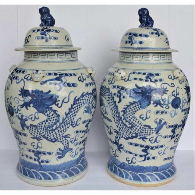 This contemporary large blue & white Chinese porcelain temple / ginger jars. These large Baluster vase have a scene of...
