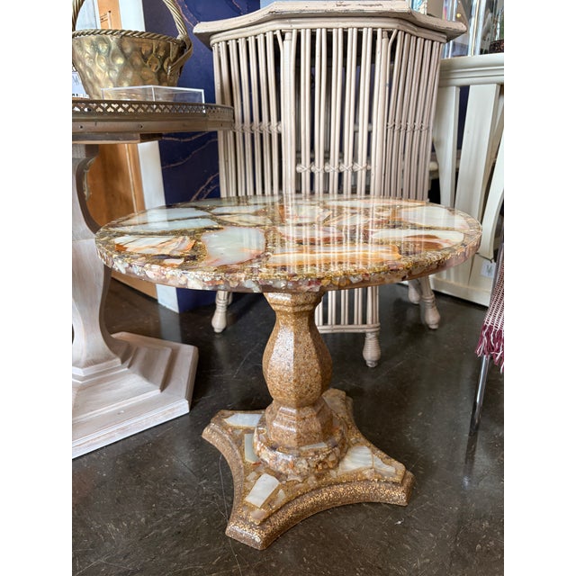 Arturo Pani inlaid shell and abalone side table, circa 1960. Features a richly textured mosaic top and matching pedestal...