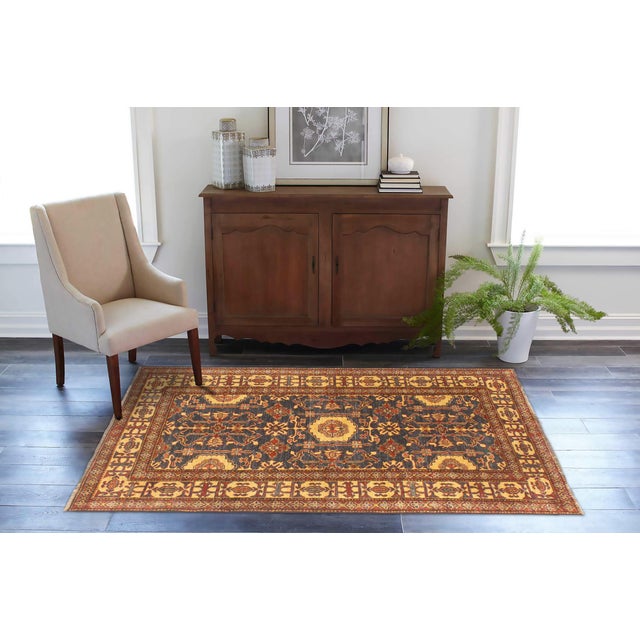 Enhance your home with this exquisite hand-knotted Super Kazak rug, crafted from fine hand-spun wool and dyed with all-...