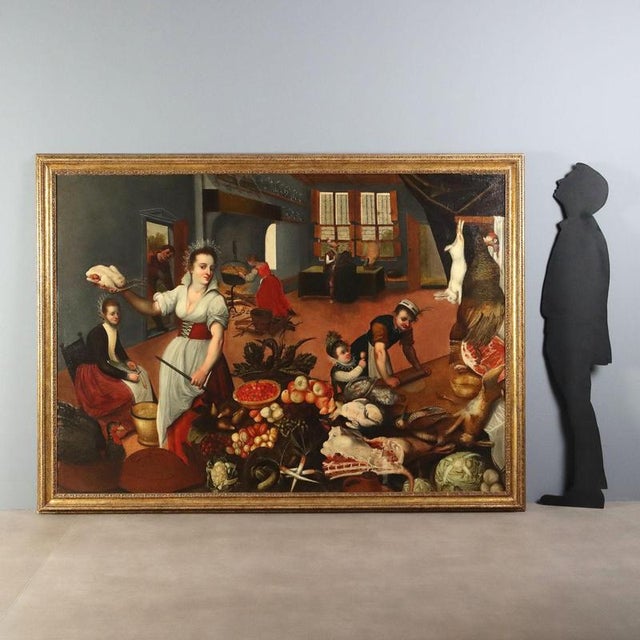 Oil on canvas from the early 17th-century Flemish school, depicting a lively interior scene of a large kitchen in a palace...