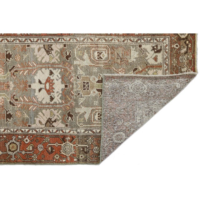 Elevate your hallway, entryway, or long corridor with the timeless character of this Antique Oriental Rug Runner....